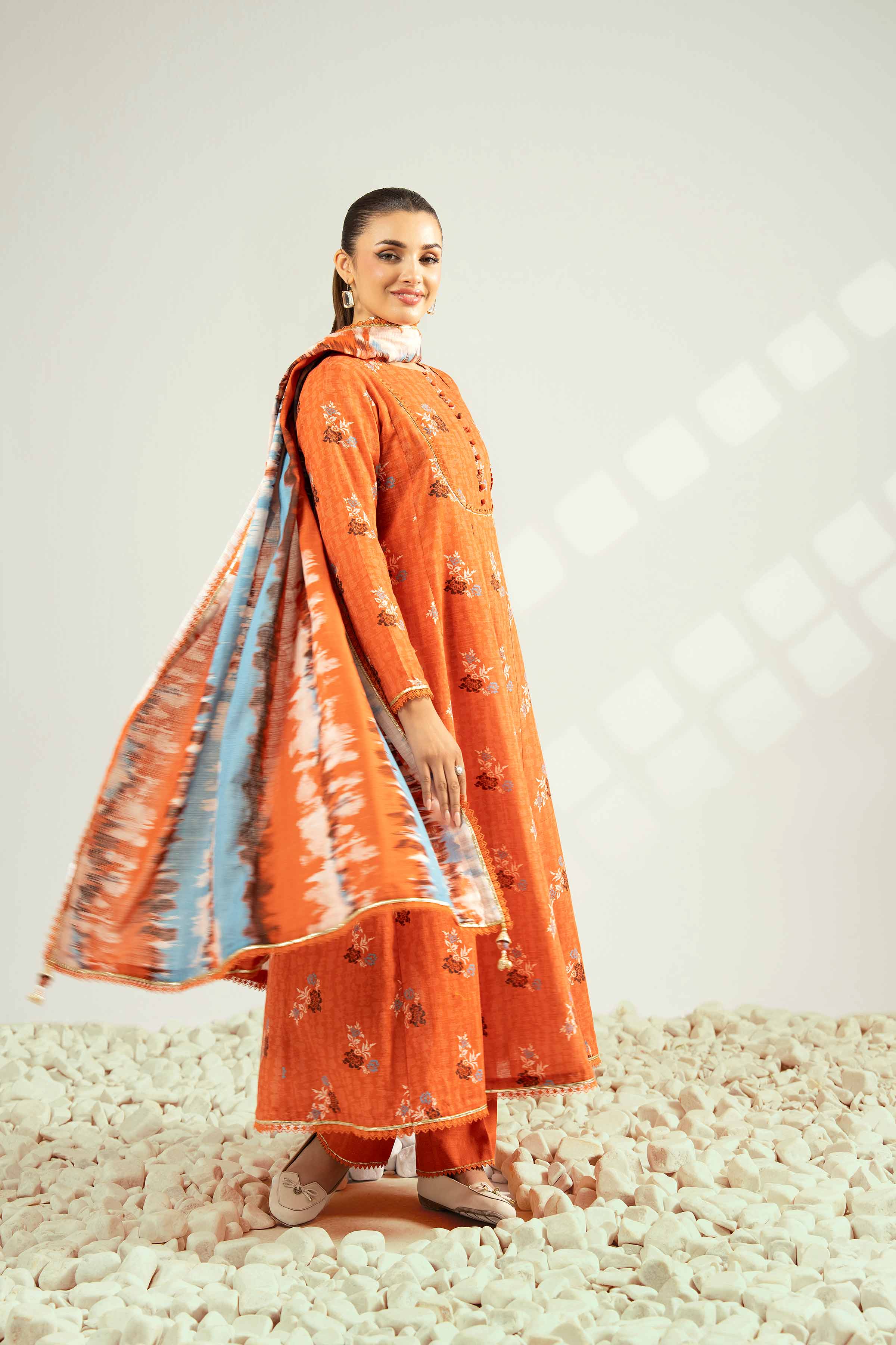 NISHATUAE - Orange Printed Khaddar 3-piece Unstitched Suit