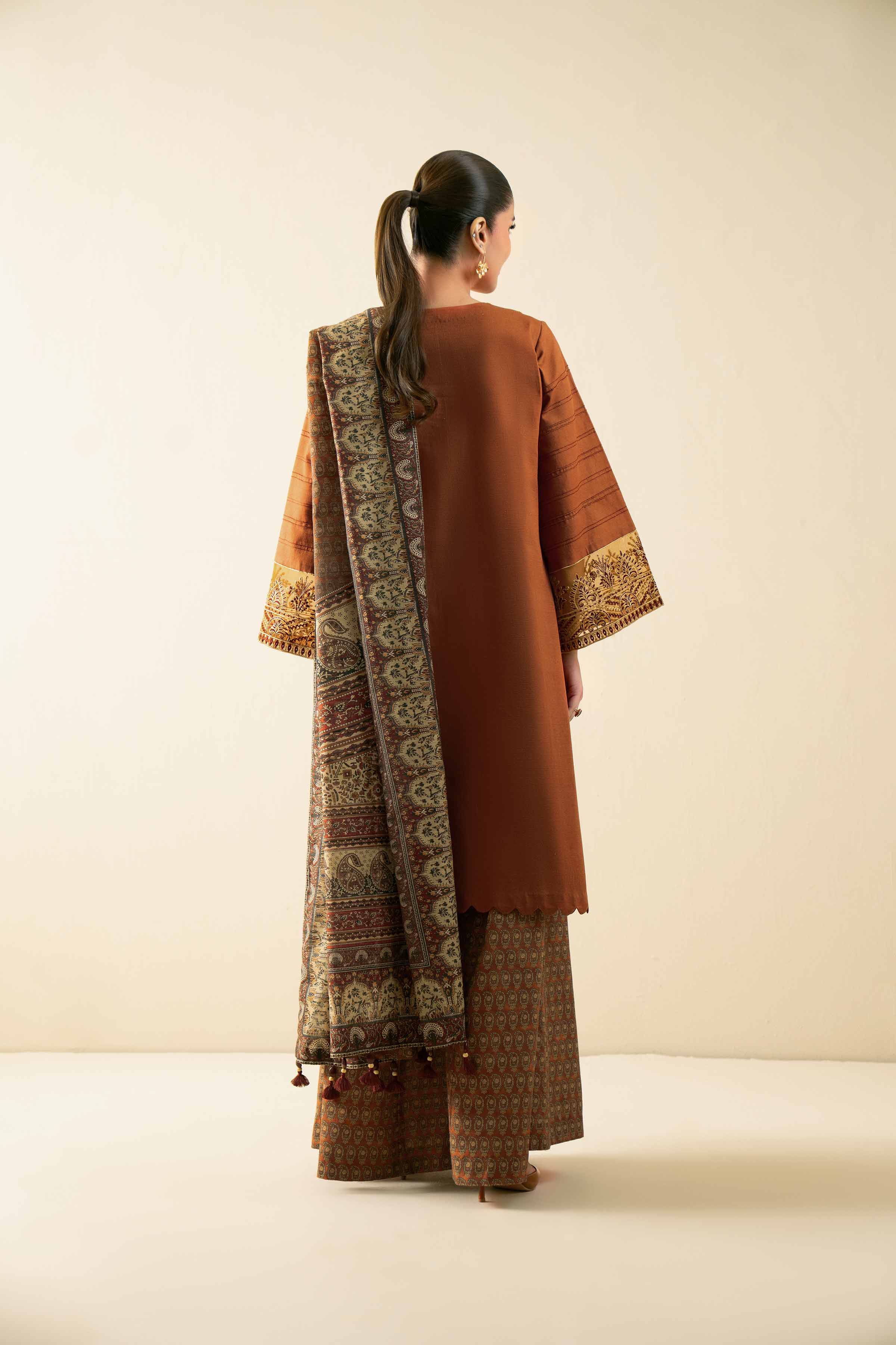 NISHATUAE - Rust Embroidered Khaddar 3-piece Unstitched Suit