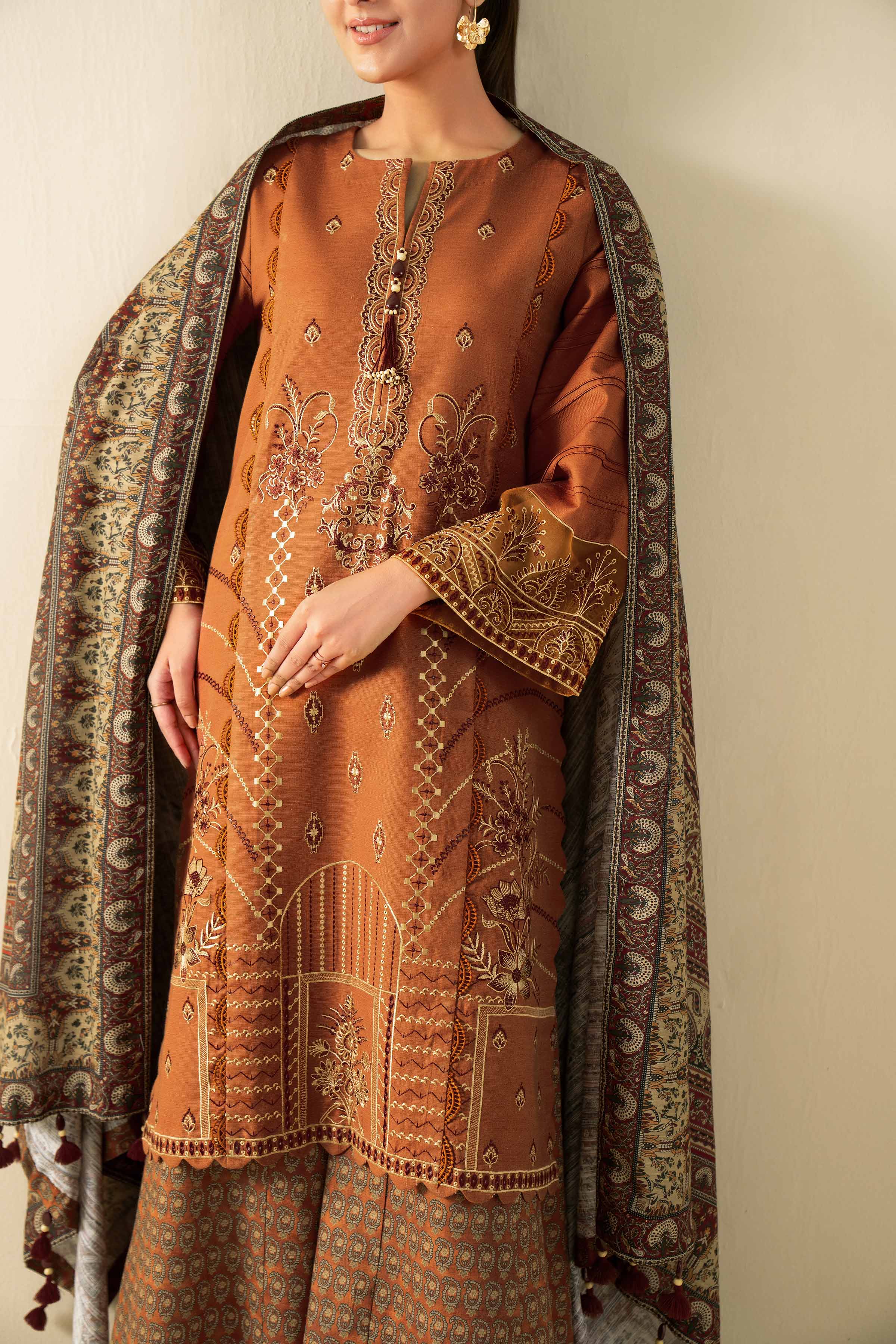 NISHATUAE - Rust Embroidered Khaddar 3-piece Unstitched Suit