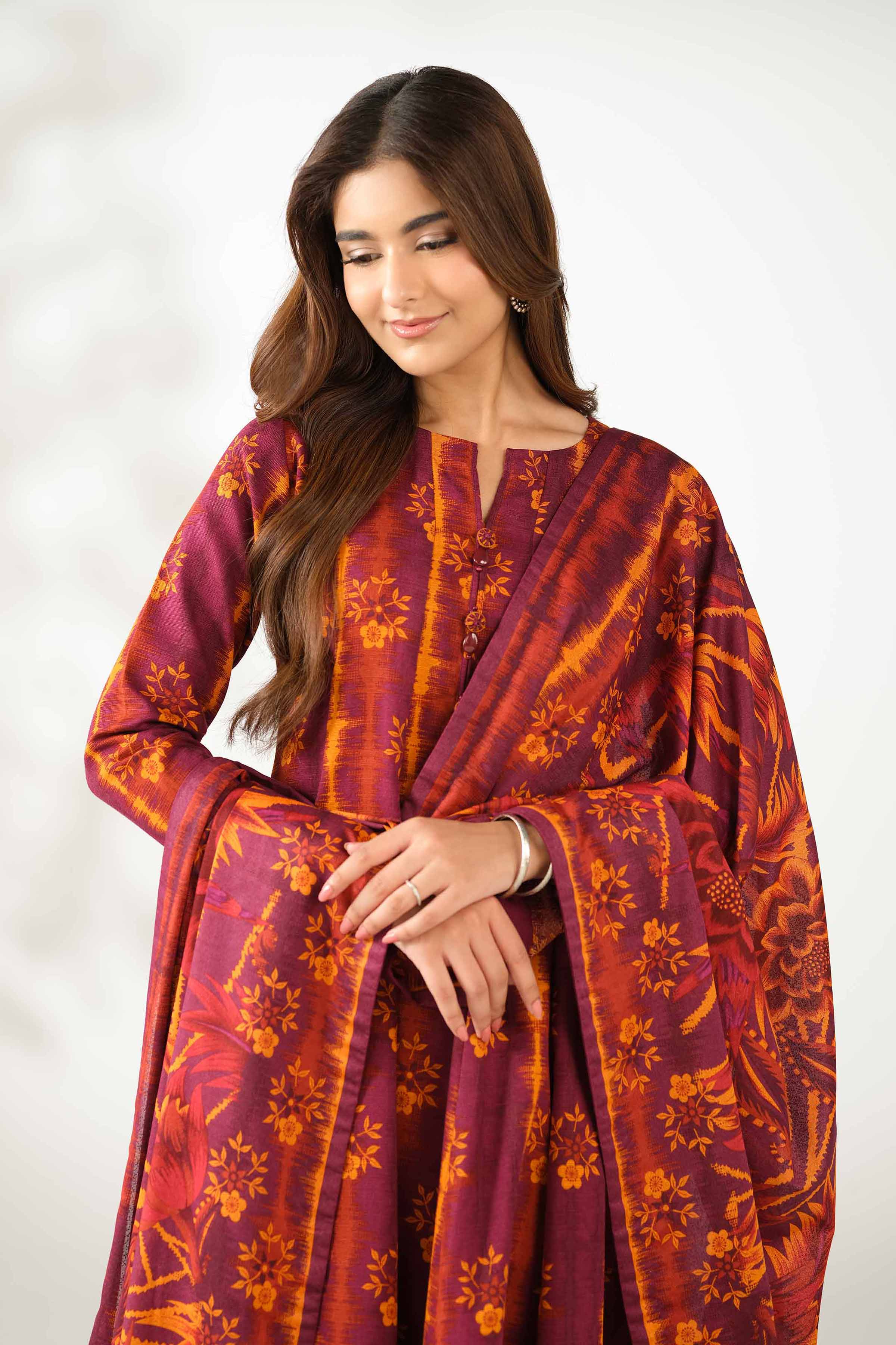 NISHATUAE - Burgundy Printed Khaddar 3-piece Unstitched Suit