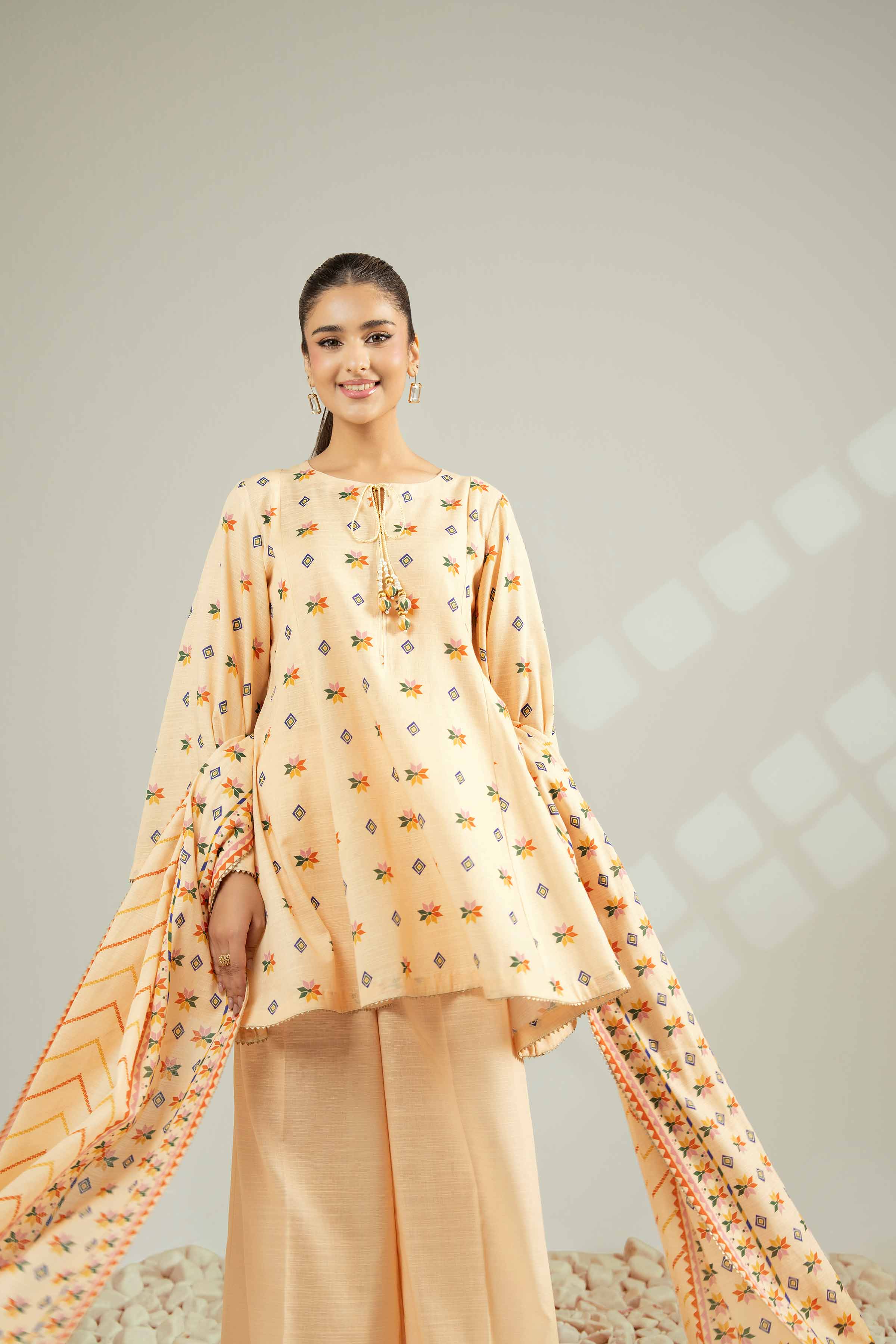 NISHATUAE - Orange Printed Khaddar 3-piece Unstitched Suit