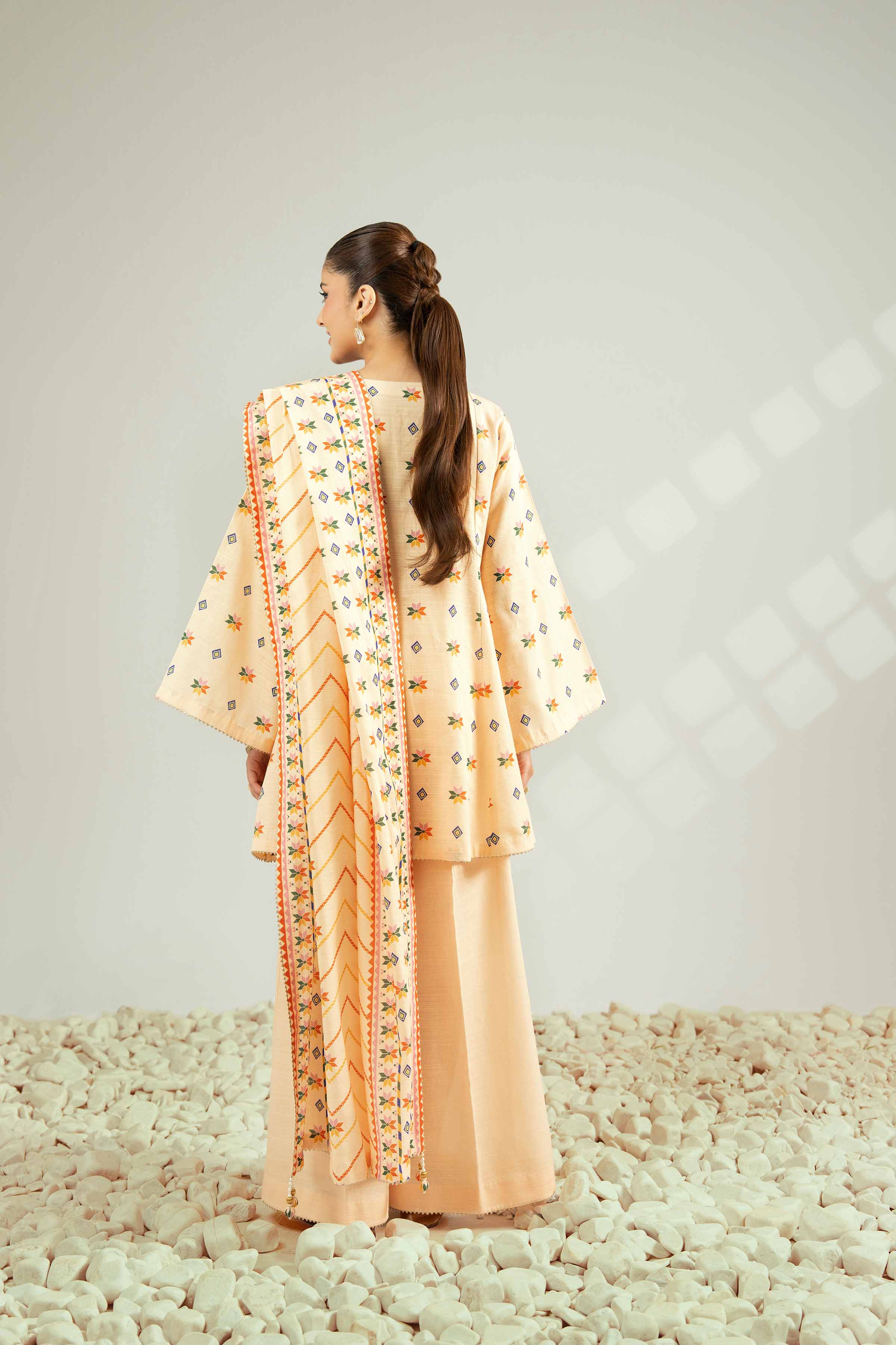 NISHATUAE - Orange Printed Khaddar 3-piece Unstitched Suit