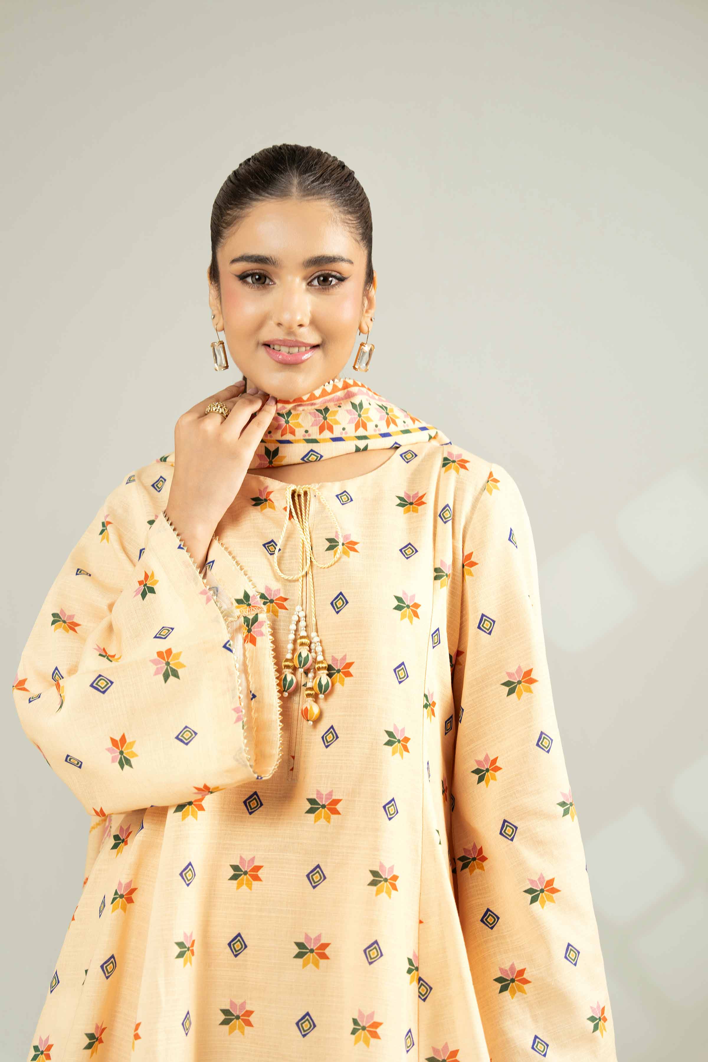 NISHATUAE - Orange Printed Khaddar 3-piece Unstitched Suit